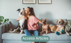 Sitting on couch with dogs